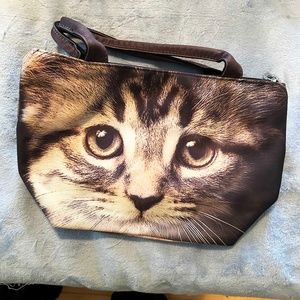 HANDBAG, CAT FACE ON BOTH SIDES & BOTTOM, TOP ZIPPER, PVC OUTER, SHORT HANDLES,